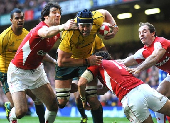 Rugby Union - Wales v Australia Invesco Perpetual Autumn Series - Millennium Stadium, Cardiff, Wales - 6/11/10 Mike Phillips - Wales (L) in action against Mark Chisholm - Australia Mandatory Credit: Action Images / Henry Browne