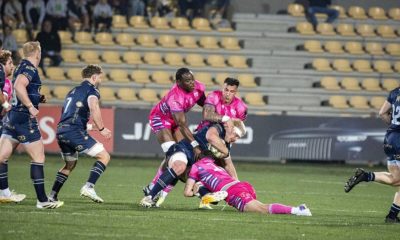 Dragons No.8 Aaron Wainwright held by Giacomo Da Re and Marco Zanon