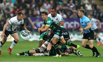 Alex Mitchell gets the ball away for Northampton Saints