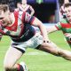 Angus Crichton, left, scoring for the Roosters