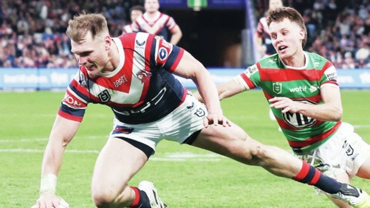 Angus Crichton, left, scoring for the Roosters
