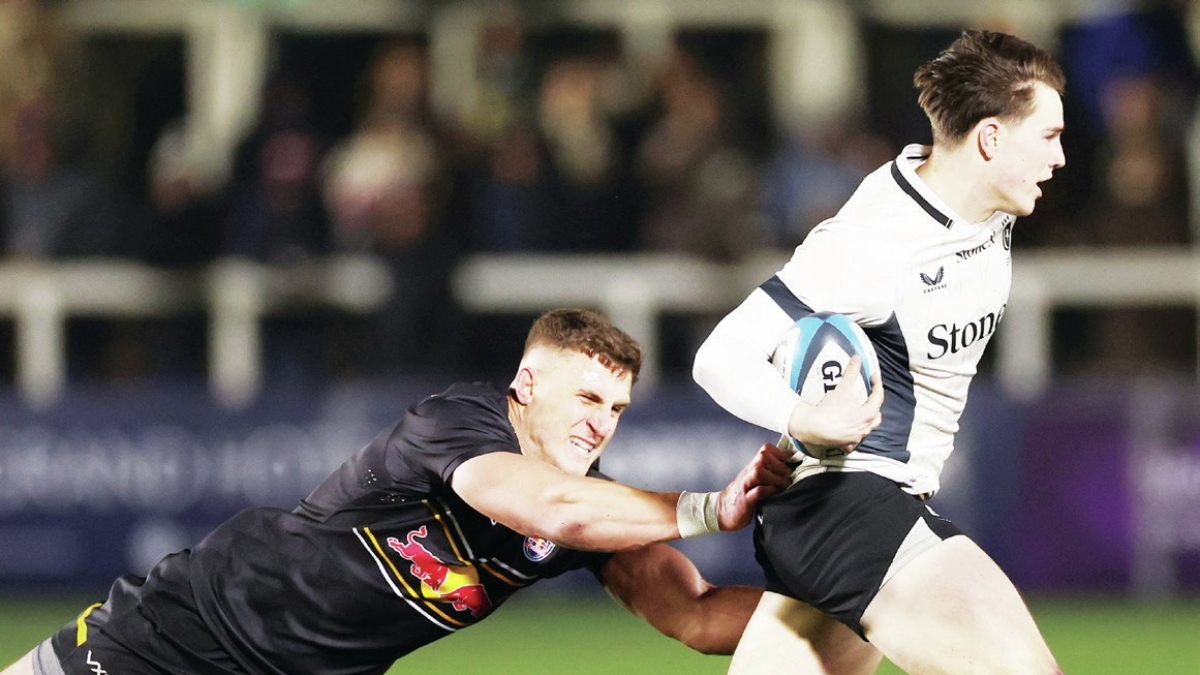 Saracens full-back Angus Hall breaks the tackle of Stefan Coetzee