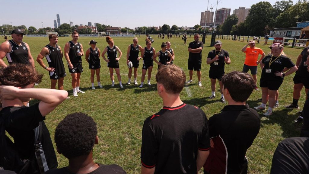 School of Hard Knocks participants join Barbarians stars during a skills session at