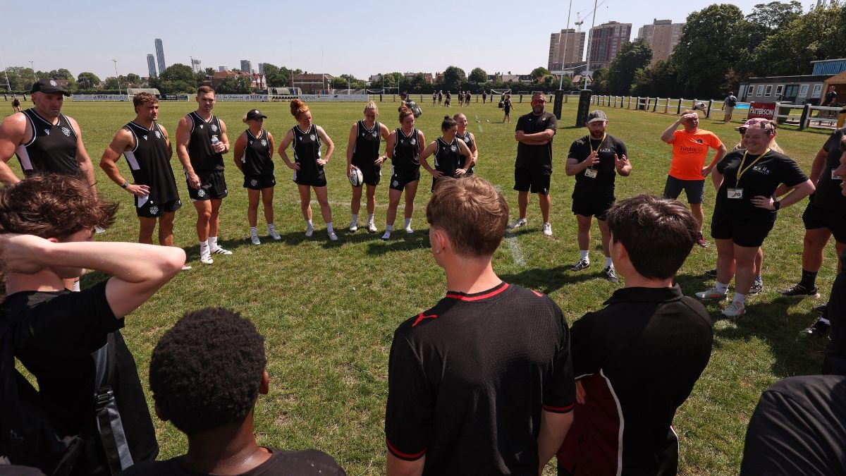 School of Hard Knocks participants join Barbarians stars during a skills session at