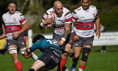 Camborne’s Herbie Stupple is tackled by James Robins