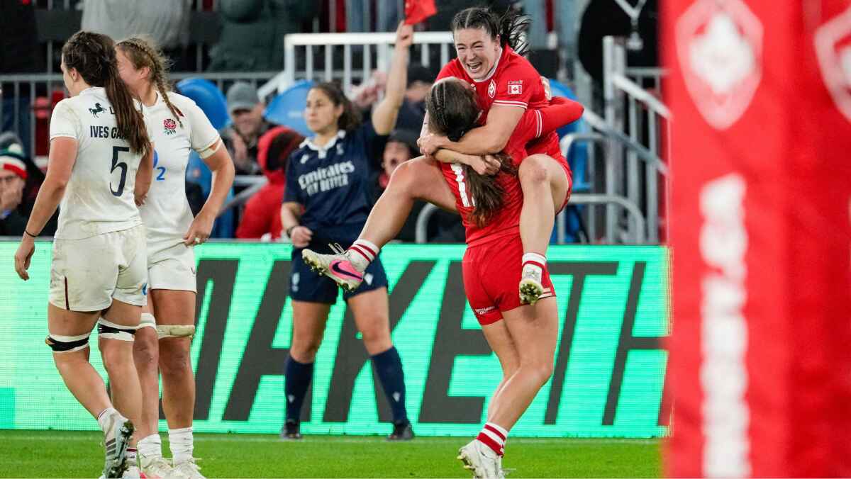 Canada’s Alysha Corrigan leaps into the arms of Taylor Perry as they celebrate their win over England