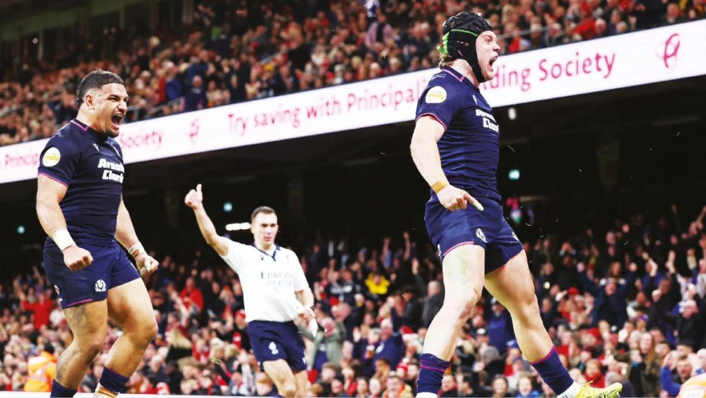 Darcy Graham celebrates scoring Scotland's third try