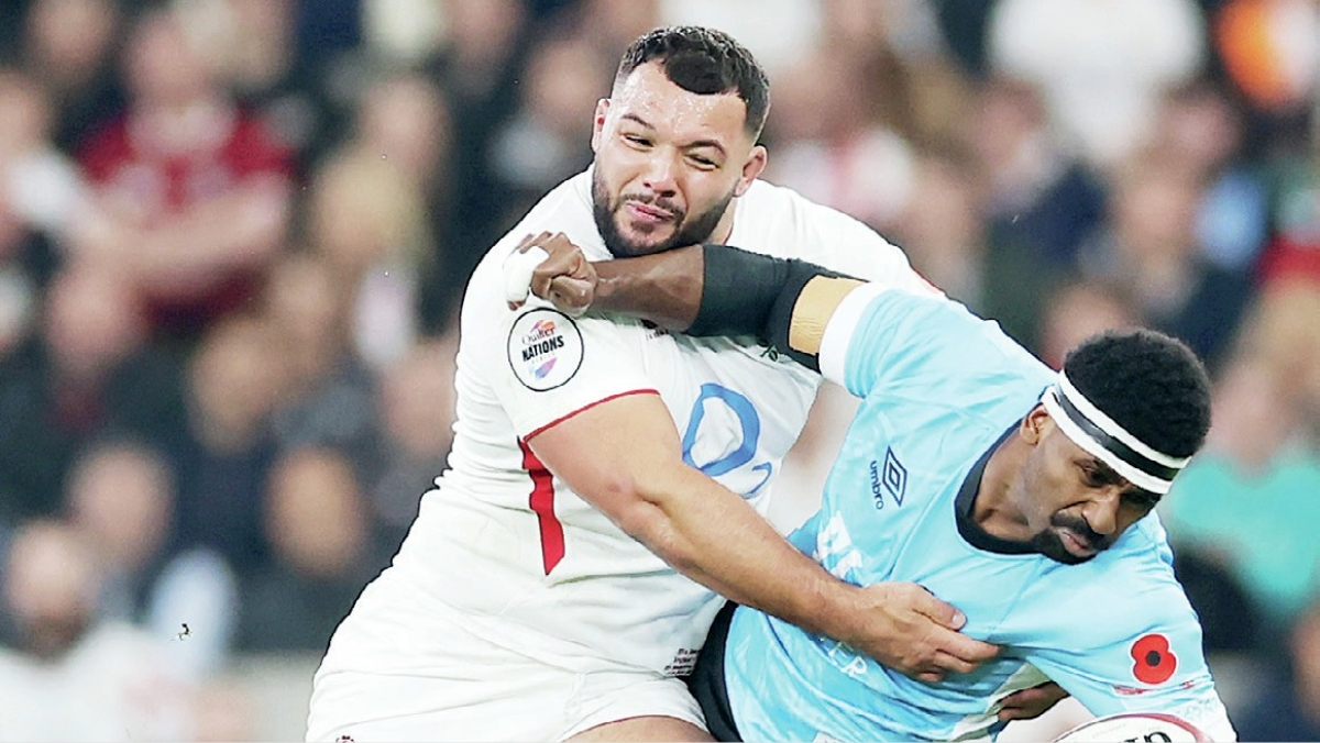 England’s Ellis Genge tackling Fiji flyer Kalaveti Ravouvou