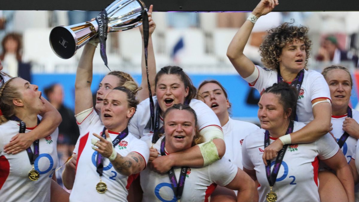 England captain Meg Jones holds the trophy aloft