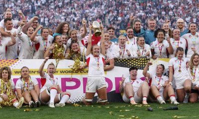 Zoe Aldcroft lifts the Women’s Rugby World Cup trophy for England
