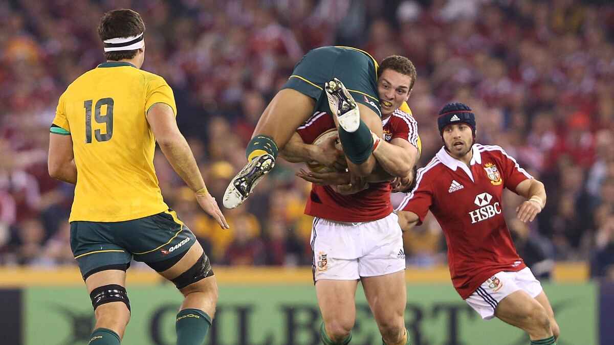 George North carrying Israel Folau on the British & Irish Lions tour in 2013