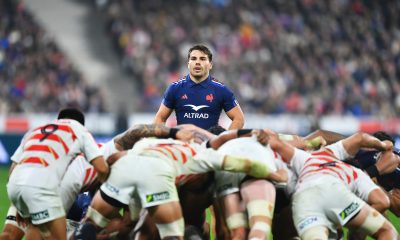 Antoine Dupont of France looks on over a scrum