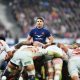 Antoine Dupont of France looks on over a scrum