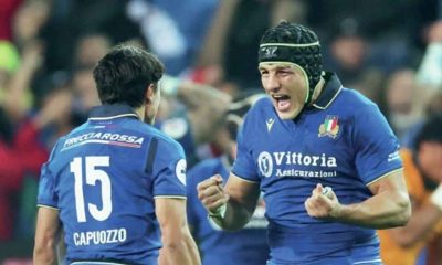 Italy’s Juan Ignacio Brex celebrates with team-mate Ange Capuozzo at full-time