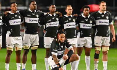 Ma’a Nonu performs his solo haka as his Sharks team-mates watch on from behind.