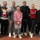 Ben Earl and Alex Lozowski (centre) help lead festive celebrations for young people with learning difficulties at the Saracens Foundation Christmas party