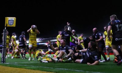Ospreys celebrate a pushover try in the corner