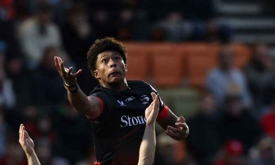 Noah Caluori jumps to win the ball against Gus Warr