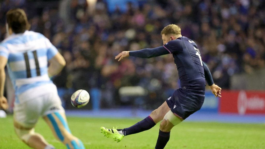 Finn Russell kicks a penalty
