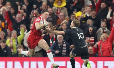 Wales’ Tom Rogers steps inside Damian McKenzie for his hat-trick