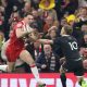 Wales’ Tom Rogers steps inside Damian McKenzie for his hat-trick