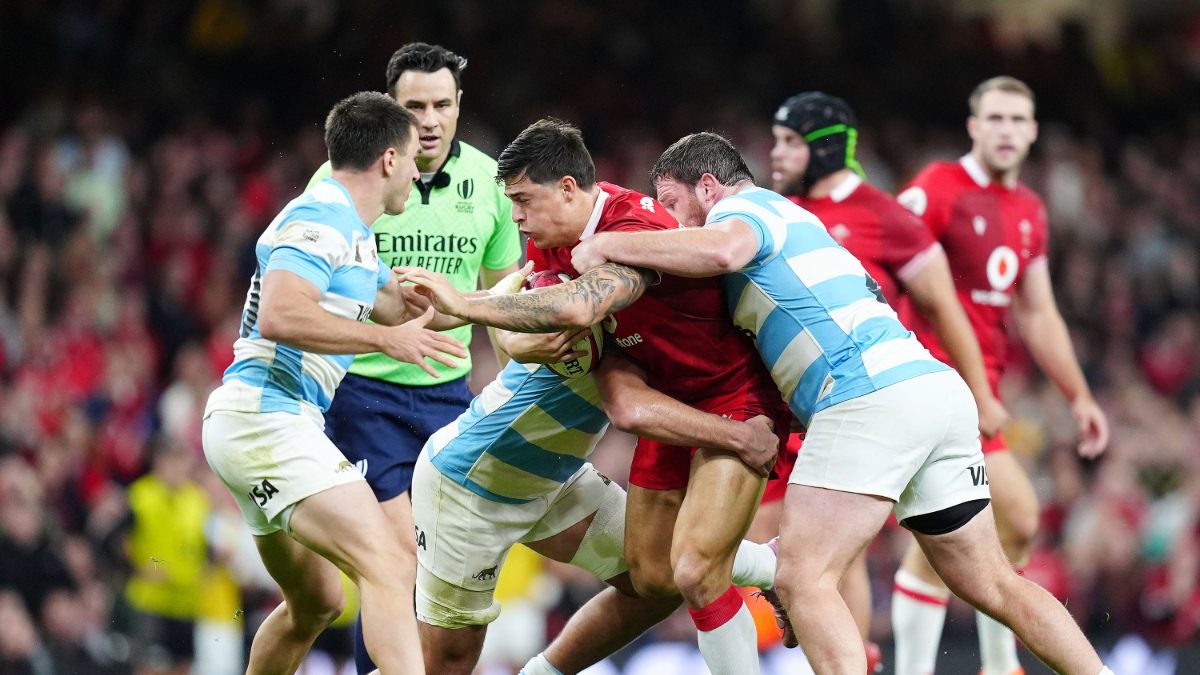 Louis Rees-Zammit, centre, is tackled during Wales' defeat to Argentina in Cardiff
