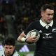 Will Jordan on his way to scoring for New Zealand.
