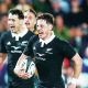 Cam Roigard runs through to score for New Zealand