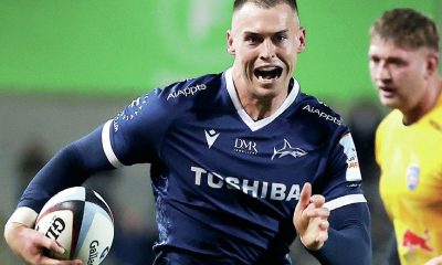 Tom Roebuck runs through for his second try for Sale Sharks