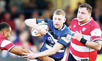 Finn Russell avoids the tackle of Will Joseph to set up a Bath attack