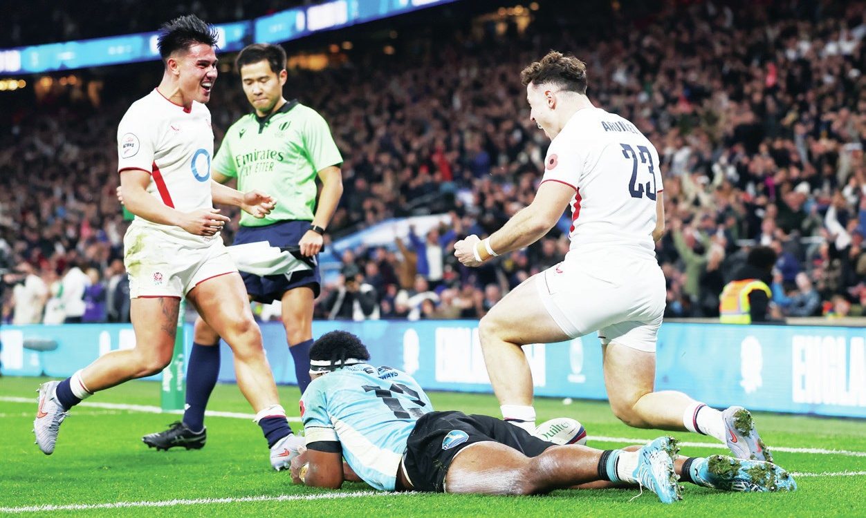 Henry Arundell celebrates scoring for England against Fiji with Marcus Smith