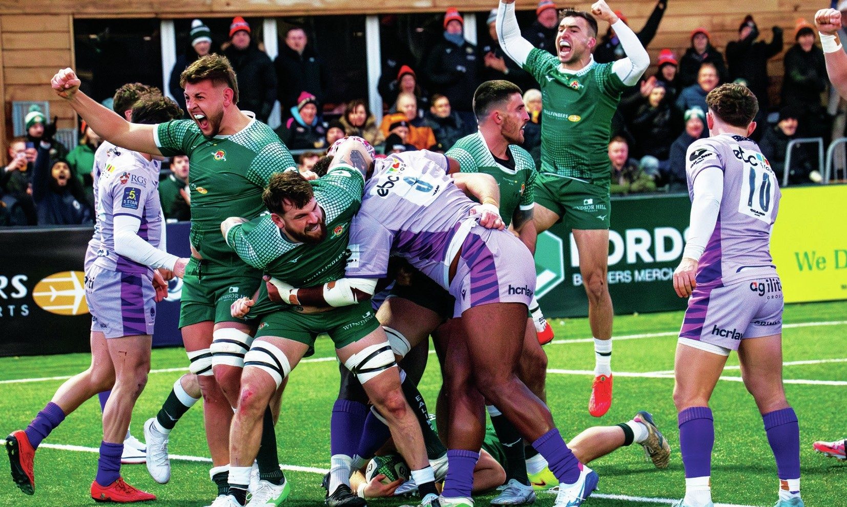 Ealing Trailfinders celebrate as Scott Buckley goes over for his second try