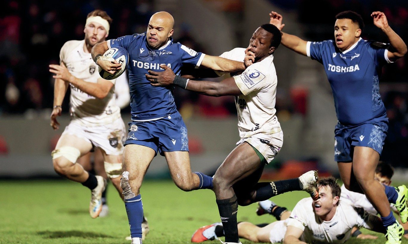 Sale Sharks’ Tom O’Flaherty hands off Tino Mavesere to score his second try