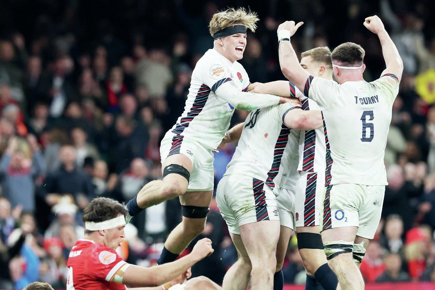 England celebrate scoring during their record win in Cardiff last season