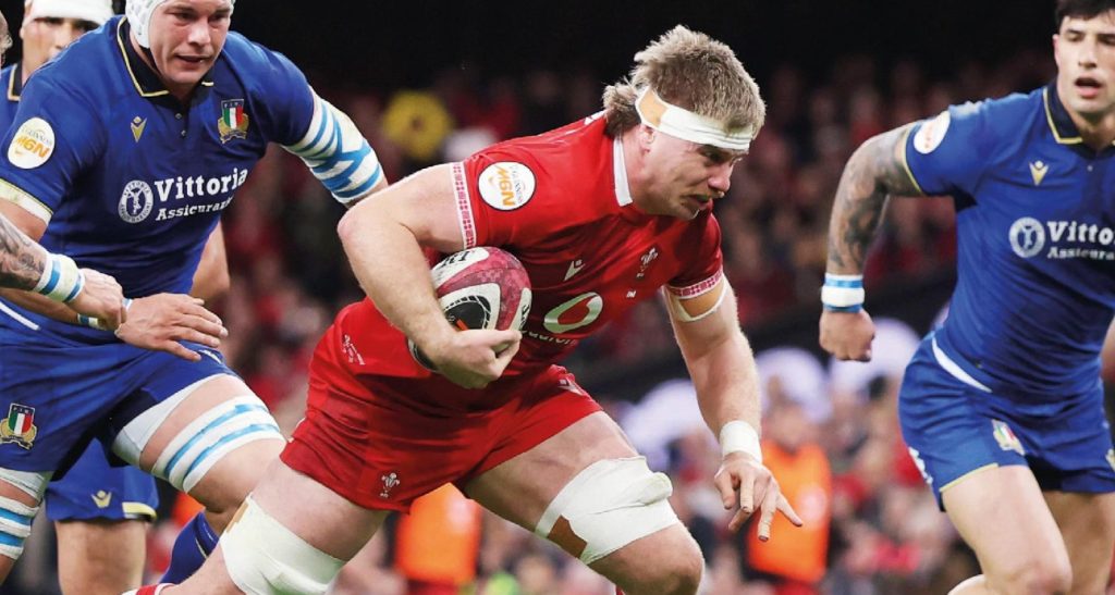 Aaron Wainwright gets the opening try for Wales