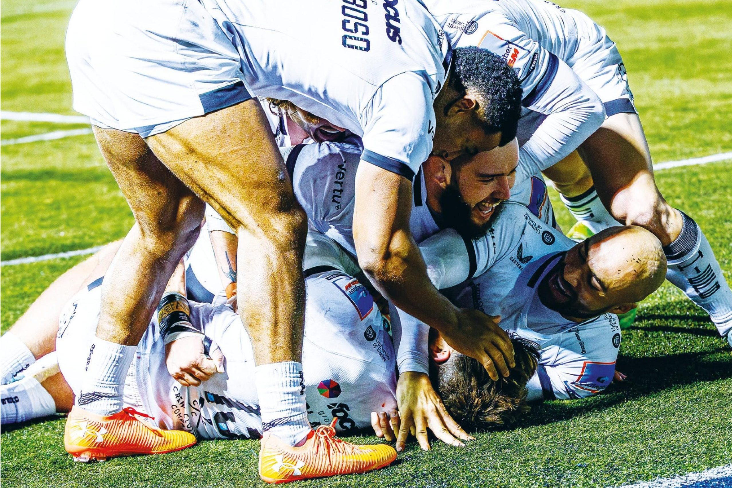 Exeter Chiefs celebrate a try by main man Henry Slade against Saracens