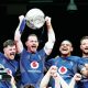 Navy captain Jarrard Hayler lifts the trophy