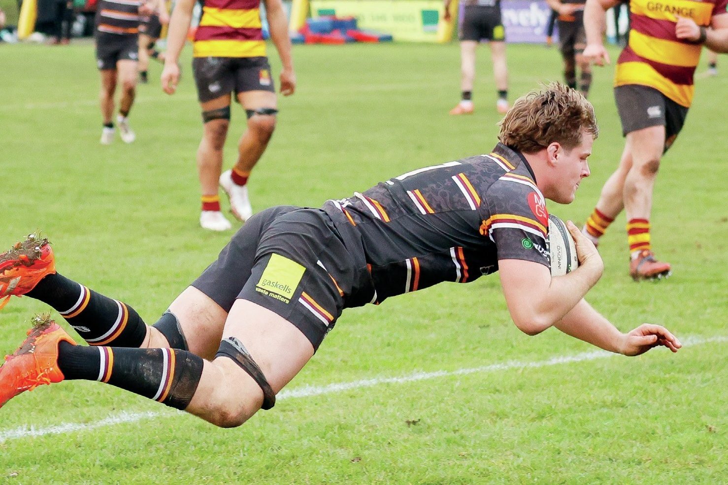 Dan Owen scoring a try for Caldy.