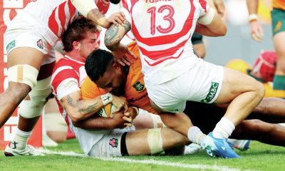 Taniela Tupou powers over to score for Australia.