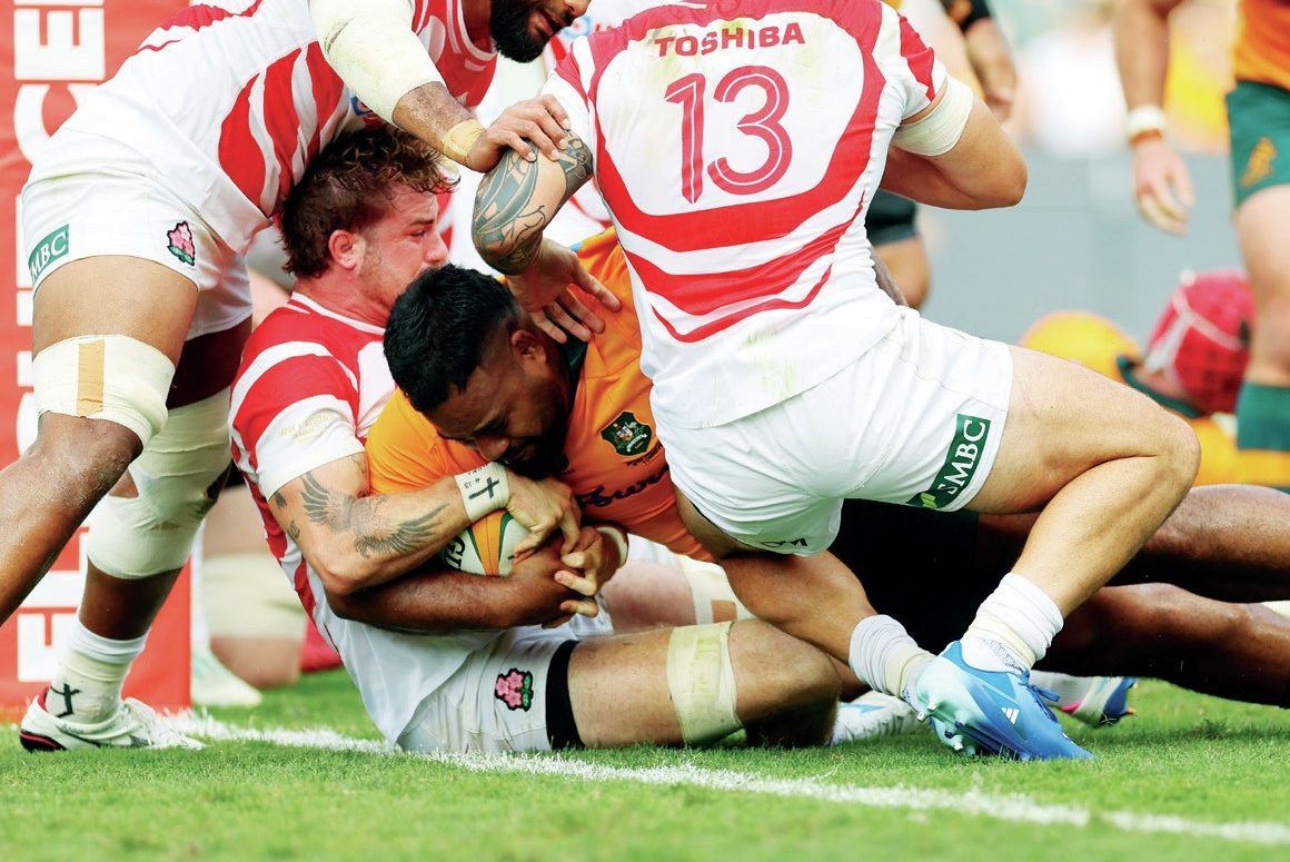 Taniela Tupou powers over to score for Australia.