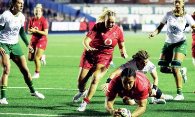 Sisilia Tuipulotu touches down for Wales.