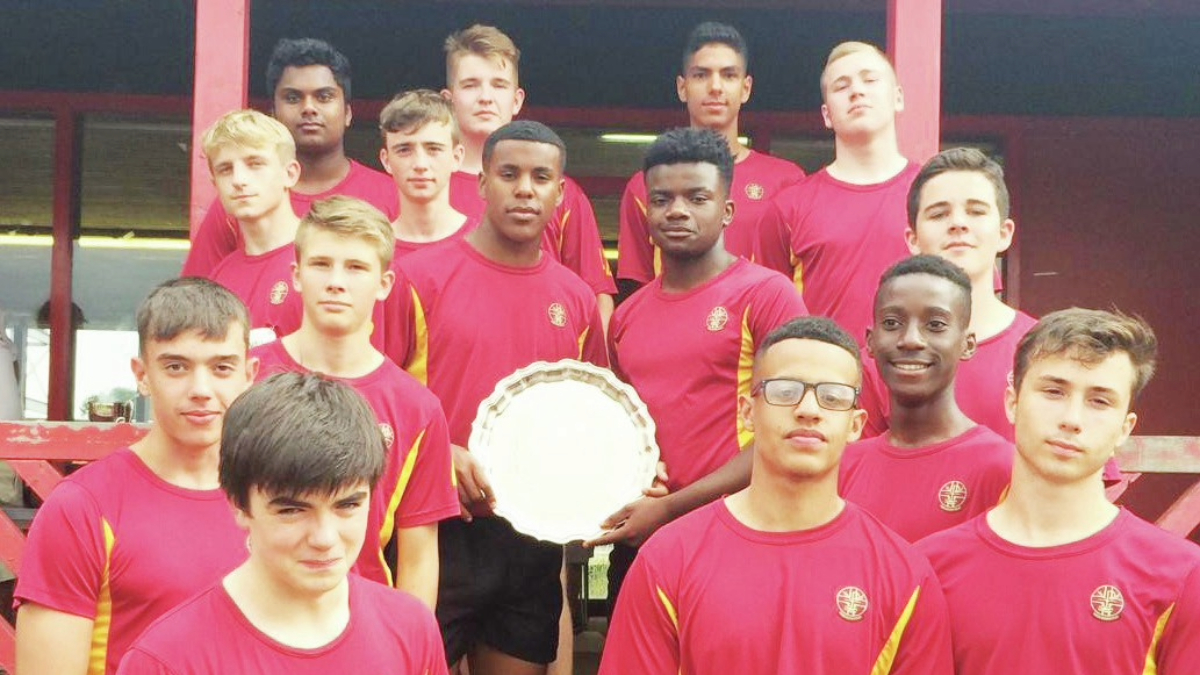 Rising star: Corpus Christi High School, Welsh Schools National U16 winners captained by Immanuel Feyi-Waboso, centre with trophy, and, inset, capped by Wales at U15 PICTURES: Corpus Christi High School